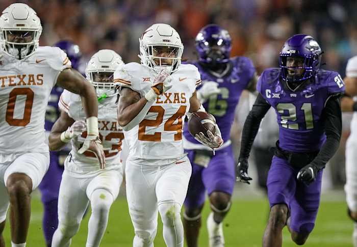 Texas Longhorns running back Jonathon Brooks (24) runs for the first down against TCU Horned Frogs in the first quarter of an NCAA college football game, Saturday, November. 11, 2023, at Amon G. Carter Stadium